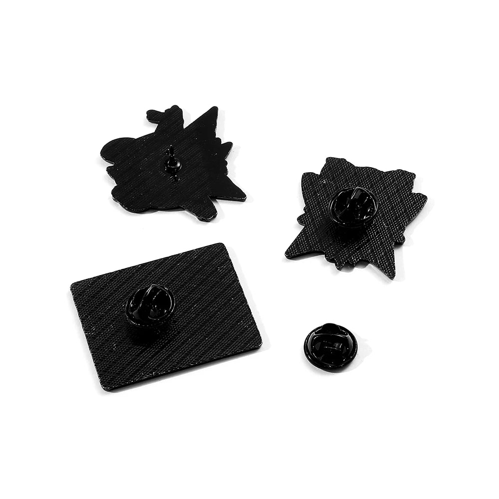 Set of black metal pins on a white background