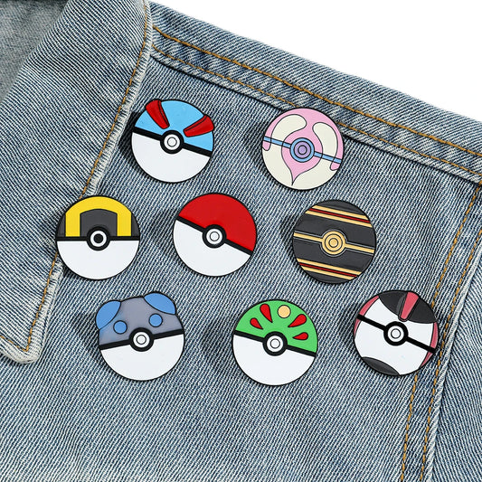 Set of colorful round Pokemon Ball lapel pins on a denim background