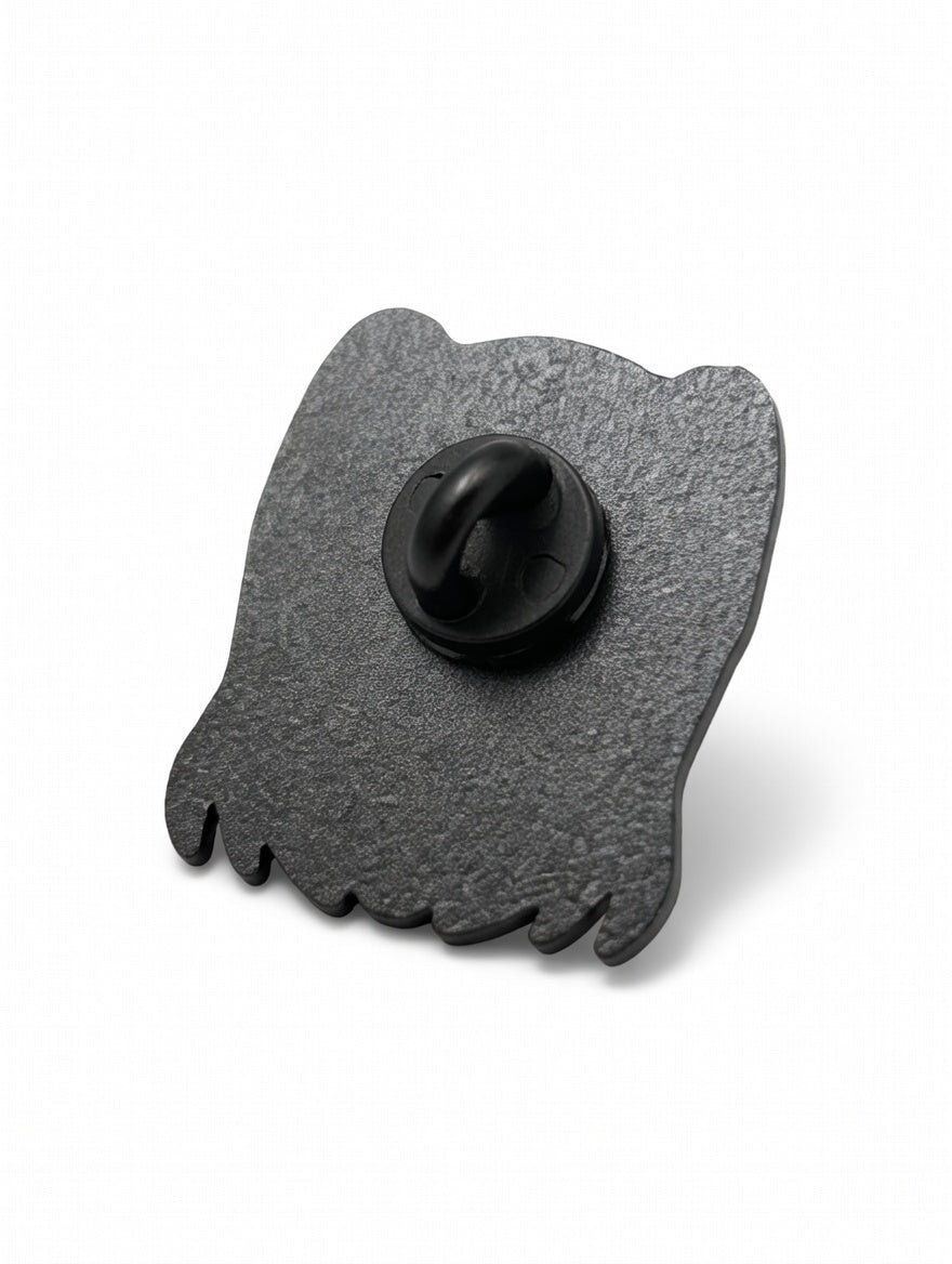 Black metal butterfly-shaped object on a white background