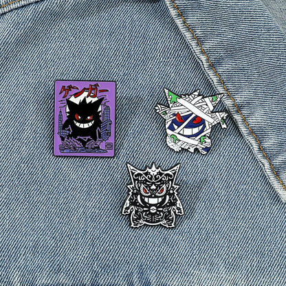 Three Pokemon Gengar enamel pins featuring different designs on a white background