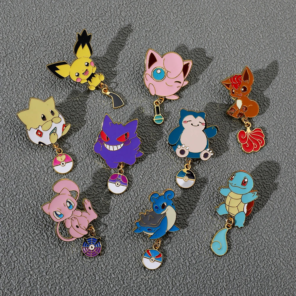 Collection of colorful cartoon Pokemon character keychains on a gray background