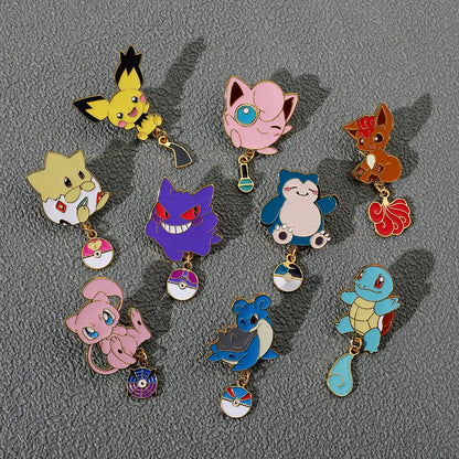 Collection of colorful cartoon Pokemon character keychains on a gray background