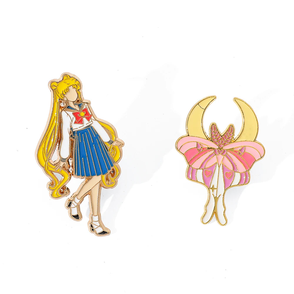 Two enamel pins featuring sailor moon character and a pink moon design on a white background