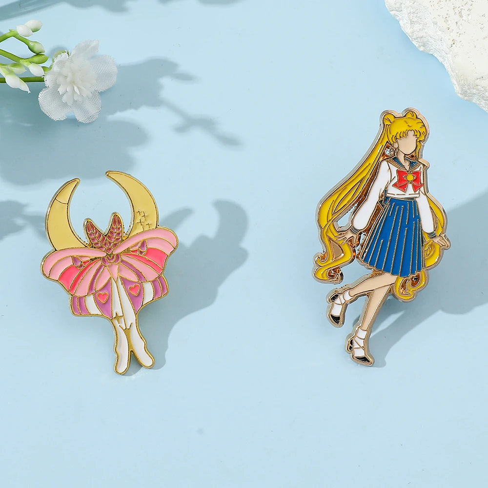 Sailor Moon-themed pins on a light blue background with flowers.
