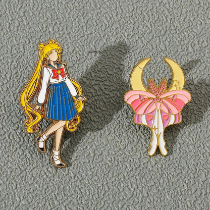 Two Sailor moon faceless 2-piece enamel pins on a textured gray background.