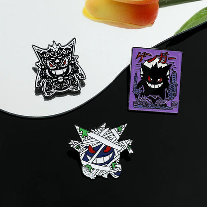 Three Pokemon Gengar enamel pins featuring different designs on a white background