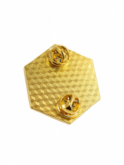 Gold hexagonal pin with a textured surface